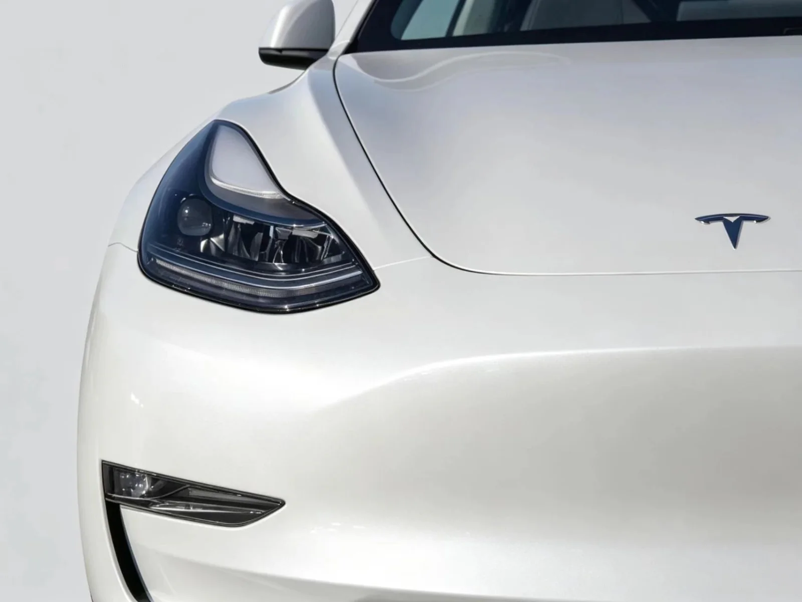 Front detail of a Tesla vehicle used as a fitment reference for compatible parts sourcing